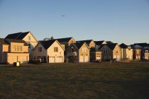 Duplexes near grassy field in countryside — Stock Photo