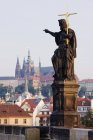 John The Baptist statue with scenic cityscape of Prague, Czech Republic — Stock Photo