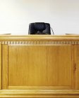 Empty judges bench and chair in court building — Stock Photo