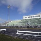 Empty running track and bleachers on sport stadium — Stock Photo