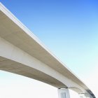 Modern concrete overpass against blue sky — Stock Photo