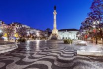 Rossio Square illuminated at night, Lisbon, Portugal — Stock Photo
