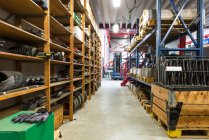 Shelves, tools and aisles in warehouse — Stock Photo