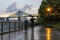 Blurred view of people jogging on Montreal waterfront, Quebec, Canada — Stock Photo