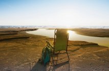 Lounge chair on beach under blue sky, Canada — Stock Photo