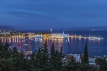 Aerial view of illuminated dock and cityscape of coastal town, Split, Croatia — Stock Photo