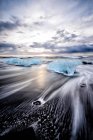 Glacier washing up on remote beach in Iceland, Europe — Stock Photo