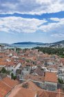 Aerial view of coastal city rooftops under cloudy sky, Trogir, Split, Croatia — Stock Photo