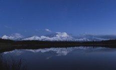 Reflection of scenic view of mountain in pond, Denali National Park, Alaska, USA — Stock Photo