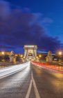 Chain Bridge illuminated at dusk, Budapest, Hungary — Stock Photo