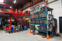 Shelves and machinery in warehouse — Stock Photo