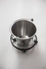 Close-up of metal bucket with stand on plain background — Stock Photo