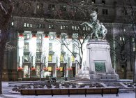 Snow on statue in city at night, Montreal City, Quebec, Canada — Stock Photo
