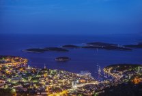 Aerial view of coastal town illuminated at night, Hvar, Split, Croatia — Stock Photo
