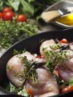 Close-up of chicken breast wrapped with herbs and vegetables — Stock Photo