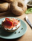 Close-up of bagel with cream cheese and lox salmon — Stock Photo