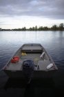 Fishing boat on calm river water — Stock Photo