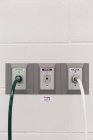 Close-up of plugs in wall in animal hospital — Stock Photo
