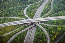 Aerial view of intersecting highways near trees, London, England — Stock Photo