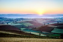 Sunrise over farmland in rural landscape — Stock Photo