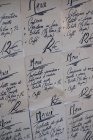 Close-up of handwritten set menus on wall at Italian restaurant. — Stock Photo