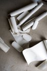 High angle close-up of rolls and cut-offs of stiff rolled drawing paper. — Stock Photo