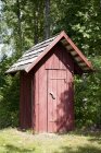 Wooden outhouse on green meadow, Sokka resort, Estonia, Europe — стоковое фото