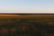 Abstract view of Tallgrass Prairie Preserve landscape at dusk in Great Plains, Kansas, USA. — Stock Photo