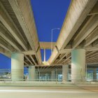Freeway overpass support structure at night, low angle view — Stock Photo