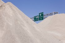 Dirt mounds with highway signs at construction site, McKinney, Texas, United States — Stock Photo