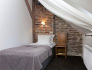 Small bedroom with stone wall of Vihula Manor, Vihula, Estonia — Stock Photo