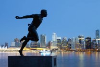 Statue of Harry Jerome in silhouette, Vancouver, British Columbia, Canada — Stock Photo