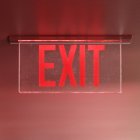 Red exit sign on ceiling, close-up — Stock Photo