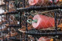 Crab and lobster pots stacked on quayside, close-up. — Stock Photo