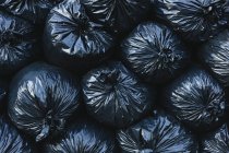 Pile of black plastic garbage bags. — Stock Photo