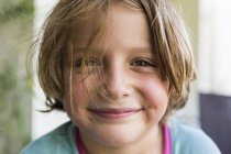 Portrait of smiling happy little blond boy looking in camera. — Stock Photo