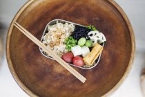 High angle close-up of vegetarian Japanese food bento in a cafe. — Stock Photo
