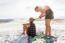 13 year old girl braiding her mothers hair, White Sands Nat'l Monument, NM — Stock Photo
