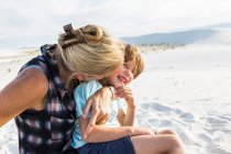 Mother and her 6 year old son embracing, White Sands National Monument, NM — Stock Photo