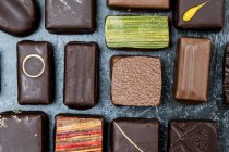 High angle close up of a selection of chocolate pralines. — Stock Photo