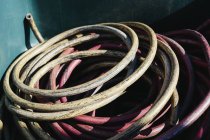 Pile of discarded industrial tubing, coiled in recycling container — Stock Photo