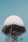 Domed radar antenna and tower, low angle view — Stock Photo