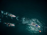Aerial shot of a group of people on paddleboards. — Stock Photo