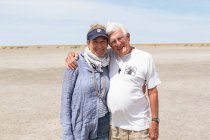Adult woman and her senior father, Kalahari Desert, Makgadikgadi Salt Pans, Botswana — Stock Photo