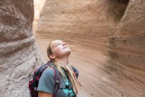 12 year old girl hiking in beautiful slot canyon, Kasha Katuwe, Tent Rocks, NM. — Stock Photo
