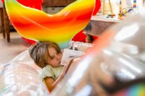5 year old boy resting in pool float at home — Stock Photo