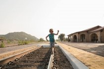 4 year old boy balancing on railroad track, Lamy, NM. — Stock Photo