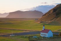 Small traditional white church near Vik, in a valley. — Stock Photo