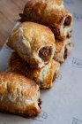 High angle close up of freshly baked sausage rolls. — Stock Photo