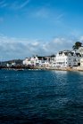View along the seawall and facades of houses in Saint Mawes, Cornwall, UK. — Stock Photo